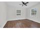 Cozy bedroom with hardwood floors, and windows offering pleasant neighborhood views at 631 Park Ave, Rocky Mount, NC 27801