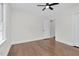 A bright bedroom with ceiling fan and hardwood floors at 631 Park Ave, Rocky Mount, NC 27801