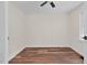 Neutral bedroom offers paneled walls, ceiling fan, and wood-look flooring at 631 Park Ave, Rocky Mount, NC 27801