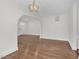 Stylish dining space with hardwood floors and modern lighting, adjacent to the entryway and kitchen at 631 Park Ave, Rocky Mount, NC 27801