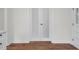 Bright hallway features frosted double doors and new wood flooring at 631 Park Ave, Rocky Mount, NC 27801