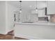 Eat-in kitchen with white cabinets, brick backsplash and quartz counters at 631 Park Ave, Rocky Mount, NC 27801