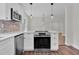Updated kitchen features stainless appliances, eat-in counter and bright lighting at 631 Park Ave, Rocky Mount, NC 27801