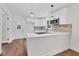 Modern kitchen featuring white cabinets, quartz countertops, and brick backsplash at 631 Park Ave, Rocky Mount, NC 27801