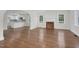 Spacious living room area with hardwood floors, fireplace, and open archway to the kitchen at 631 Park Ave, Rocky Mount, NC 27801