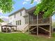 Backyard featuring a covered patio, a well manicured lawn, and a screened-in porch at 7906 Longleaf Branch Ct, Raleigh, NC 27612