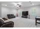 Finished basement with comfortable seating and entertainment area at 7906 Longleaf Branch Ct, Raleigh, NC 27612