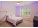Cozy bedroom featuring a hammock chair, window seat, and ambient lighting at 7906 Longleaf Branch Ct, Raleigh, NC 27612