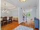 Inviting entryway showcases hardwood flooring, a staircase, and a dining room at 7906 Longleaf Branch Ct, Raleigh, NC 27612