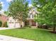 Charming two-story home with a well-manicured lawn and attached two-car garage at 7906 Longleaf Branch Ct, Raleigh, NC 27612