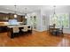 Beautiful kitchen with center island, stainless appliances, and hardwood floors at 7906 Longleaf Branch Ct, Raleigh, NC 27612