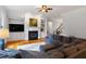 Living room with fireplace, built-in shelving, and hardwood floors at 7906 Longleaf Branch Ct, Raleigh, NC 27612