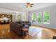 Bright living room with hardwood floors and view of the kitchen at 7906 Longleaf Branch Ct, Raleigh, NC 27612