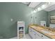 Bathroom with a double vanity, granite countertop, and built-in storage at 8004 Gabriels Bend Dr, Raleigh, NC 27612