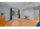 This is a well-lit, spacious room with hardwood floors, a window, and an electric keyboard at 8004 Gabriels Bend Dr, Raleigh, NC 27612