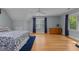 Spacious bedroom features hardwood floors, ample natural light, and a serene atmosphere at 8004 Gabriels Bend Dr, Raleigh, NC 27612