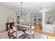 Bright and airy dining room adjacent to the living area, perfect for entertaining at 8004 Gabriels Bend Dr, Raleigh, NC 27612