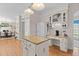 Well-equipped kitchen with ample counter space, white cabinets, and a serving area at 8004 Gabriels Bend Dr, Raleigh, NC 27612