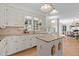 Bright kitchen with white cabinets, granite countertops, and hardwood flooring at 8004 Gabriels Bend Dr, Raleigh, NC 27612