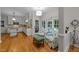 Cozy kitchen nook featuring hardwood floors, French doors and charming floral armchairs at 8004 Gabriels Bend Dr, Raleigh, NC 27612
