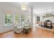Sun-drenched living space with seating area and view into dining room at 8004 Gabriels Bend Dr, Raleigh, NC 27612