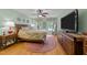 Comfortable main bedroom with a ceiling fan, carpeted floors, and natural light at 8004 Gabriels Bend Dr, Raleigh, NC 27612