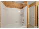 Bright bathroom with white-tiled shower/tub combo and neutral walls at 809 Valerie Dr, Raleigh, NC 27606