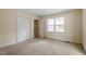Bright bedroom featuring a closet, plush carpet and bright interior at 809 Valerie Dr, Raleigh, NC 27606