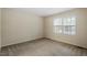 Neutral bedroom with natural light coming from the windows at 809 Valerie Dr, Raleigh, NC 27606