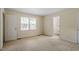 This bedroom features a closet, neutral carpet, bright interior at 809 Valerie Dr, Raleigh, NC 27606