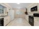 Well-lit kitchen with white cabinets and a range oven offering a functional space at 809 Valerie Dr, Raleigh, NC 27606