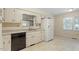 Bright kitchen featuring white cabinets and countertops providing an efficient cooking area at 809 Valerie Dr, Raleigh, NC 27606