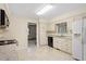 Bright kitchen featuring white cabinets and countertops providing an efficient cooking area at 809 Valerie Dr, Raleigh, NC 27606