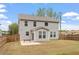 Large backyard with wood fence, patio with furniture, and ample green space at 815 Harmony Ranch Ln, Franklinton, NC 27525