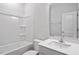 Modern bathroom with a combined shower and tub, and a sleek vanity with solid surface counter top at 815 Harmony Ranch Ln, Franklinton, NC 27525