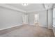 Large bedroom featuring plush carpet and access to the ensuite bathroom at 815 Harmony Ranch Ln, Franklinton, NC 27525