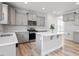 Spacious kitchen features light grey cabinetry, white counter tops, and stainless steel appliances at 815 Harmony Ranch Ln, Franklinton, NC 27525