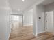 Open-concept living area with luxury vinyl flooring and lots of natural light at 815 Harmony Ranch Ln, Franklinton, NC 27525