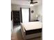 A nicely decorated bedroom with ceiling fan, upholstered headboard, and built-in shelves at 8600 Colville Ct, Raleigh, NC 27617