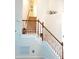 Elegant staircase featuring wooden handrails and spindles leading to the upper level at 8600 Colville Ct, Raleigh, NC 27617