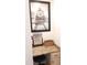Close up of the vanity area, featuring a makeup mirror, granite counter, and storage basket at 8600 Colville Ct, Raleigh, NC 27617