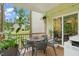Cozy screened-in porch with outdoor seating, plants, and natural light at 947 Weatherby Ln, Creedmoor, NC 27522
