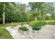 Beautiful backyard garden with raised beds and stone pathways, perfect for gardening enthusiasts at 947 Weatherby Ln, Creedmoor, NC 27522