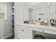 Bright bathroom features white vanity with drawers, cabinets, and a large mirror, as well as modern fixtures at 947 Weatherby Ln, Creedmoor, NC 27522
