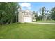 Charming two-story home with a well-maintained lawn and a two-car garage at 947 Weatherby Ln, Creedmoor, NC 27522