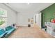 Bright play room features plush furniture, an open closet, and natural light at 947 Weatherby Ln, Creedmoor, NC 27522