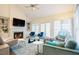 Spacious living room featuring a fireplace, built-in shelving, and ample natural light at 10 Marchmont Ct, Durham, NC 27705
