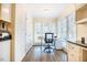 Office space with built in shelves and cabinets, a desk, and multiple windows at 10 Marchmont Ct, Durham, NC 27705