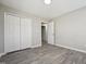 Cozy bedroom with laminate floors, double door closet, and neutral decor, creating a serene and inviting private retreat at 105 Leacroft Way, Durham, NC 27703