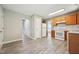 Spacious kitchen featuring wood cabinets, white appliances, tile backsplash, and an open layout at 105 Leacroft Way, Durham, NC 27703